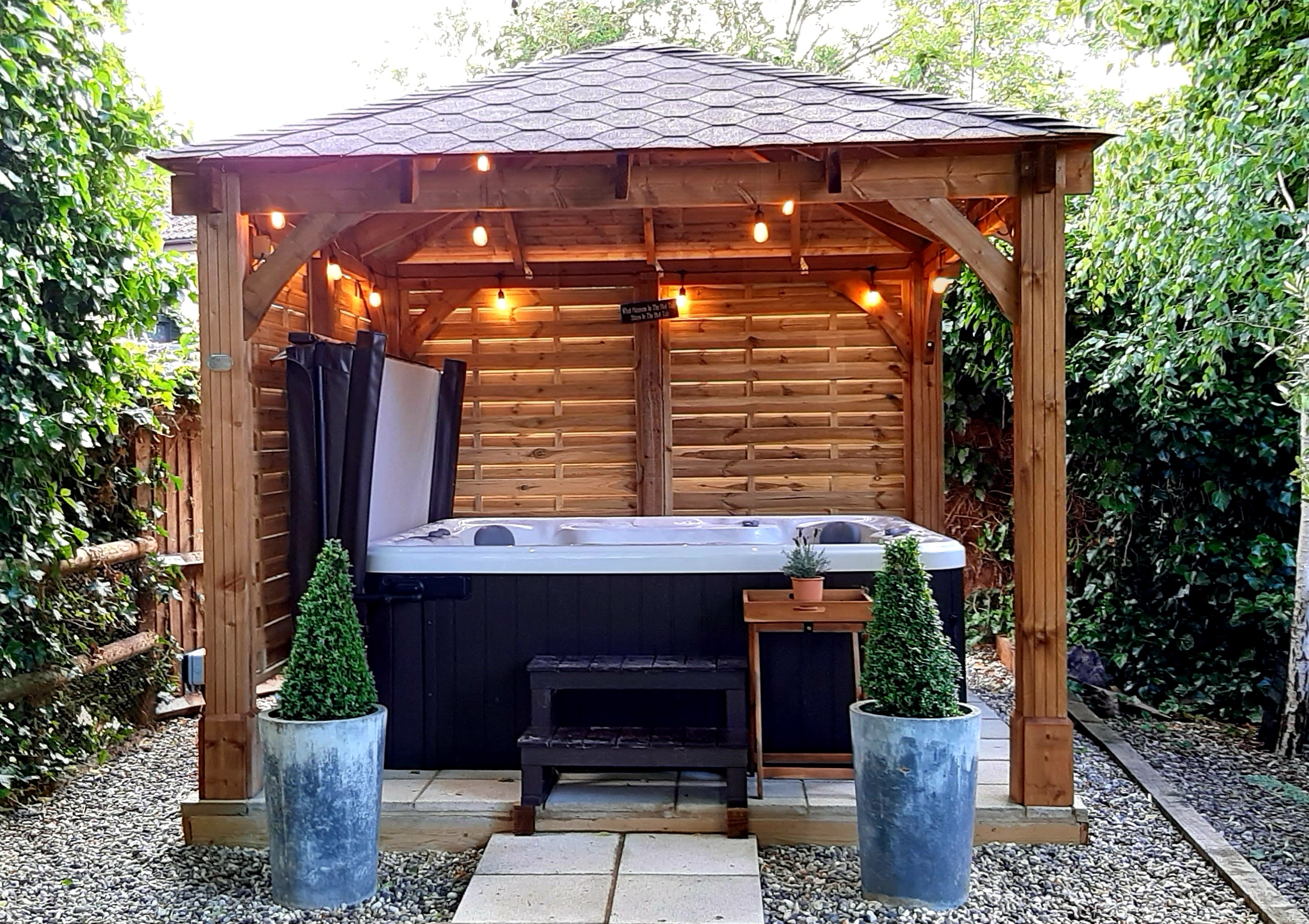 Gazebo with hot tub under