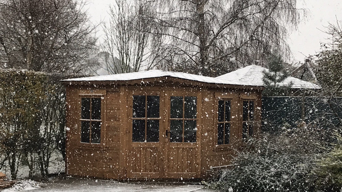 Winter Log Cabin in the snow