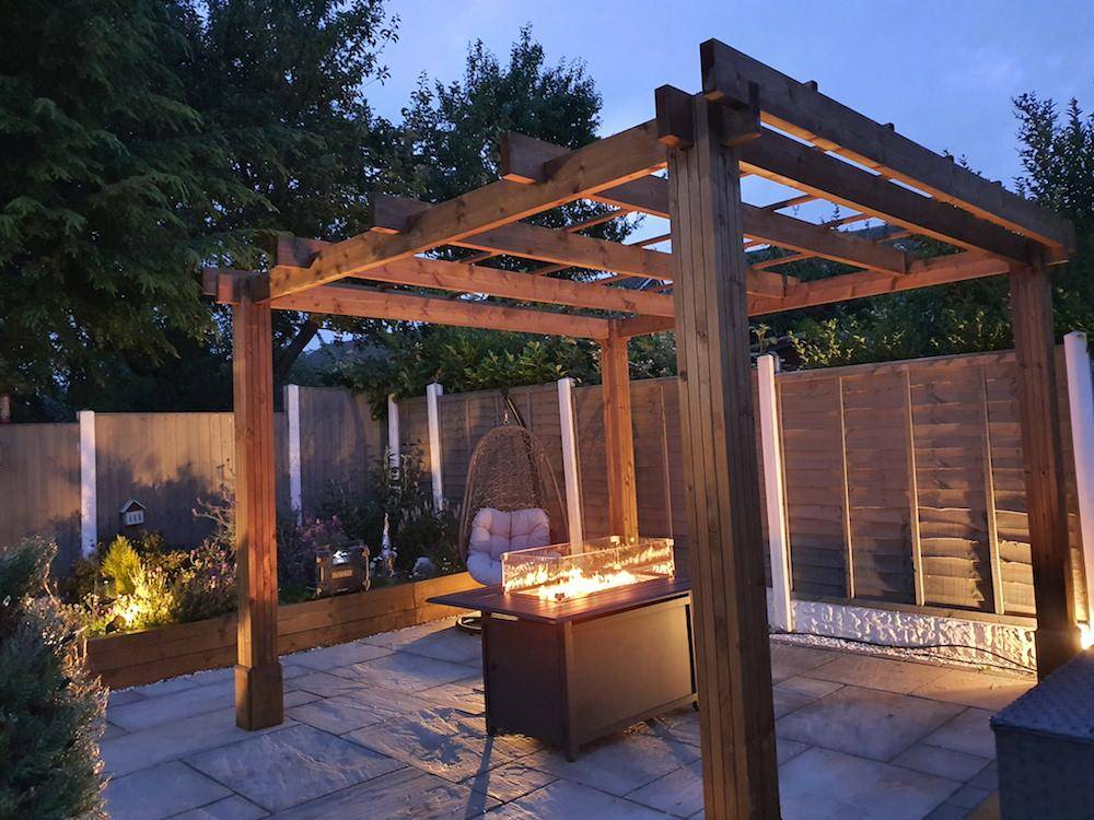 Add a fireplace under your Pergola for cosy nights in the garden