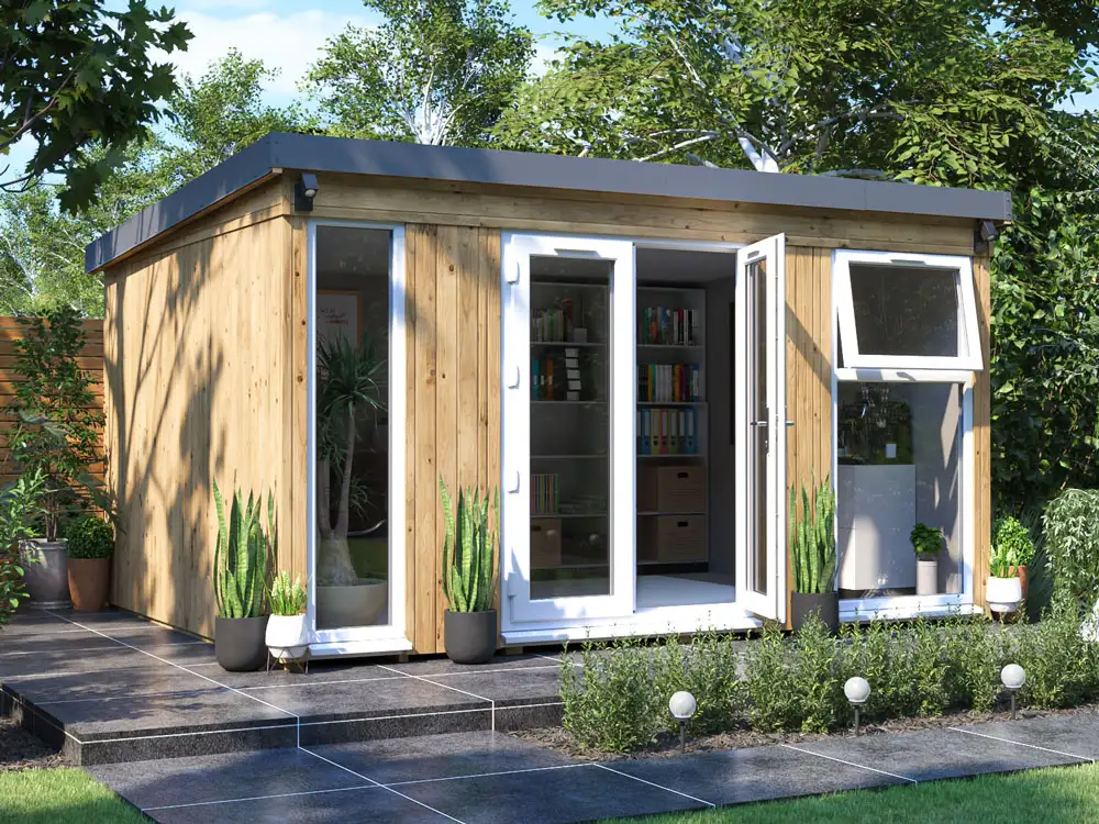 A modern wooden garden office with a flat grey roof and white double doors. It has large windows, a paved patio area, and is surrounded by greenery.